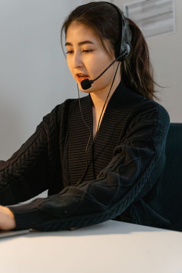 Kenji, support team member helping a customer from his desk